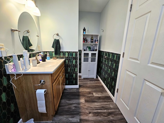 10040 S Reese Rd, Birch Run, MI 48415 - bathroom with wainscoting, vanity, wood finished floors, and tile walls