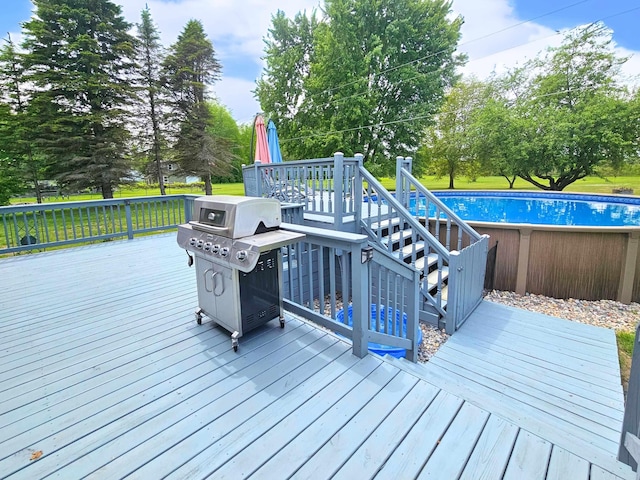10040 S Reese Rd, Birch Run, MI 48415 - wooden deck featuring an outdoor pool, stairway, and view of scattered trees