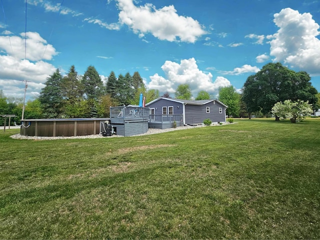 10040 S Reese Rd, Birch Run, MI 48415 - view of grassy yard featuring a swimming pool and a deck