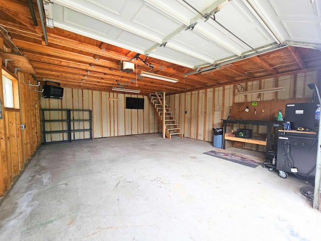 10040 S Reese Rd, Birch Run, MI 48415 - garage featuring a garage door opener and a workshop area