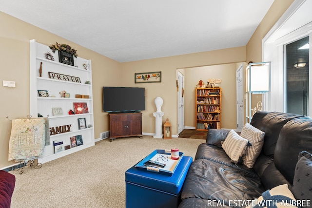 38 W 31st St, Holland, MI 49423 - carpeted living room featuring baseboards