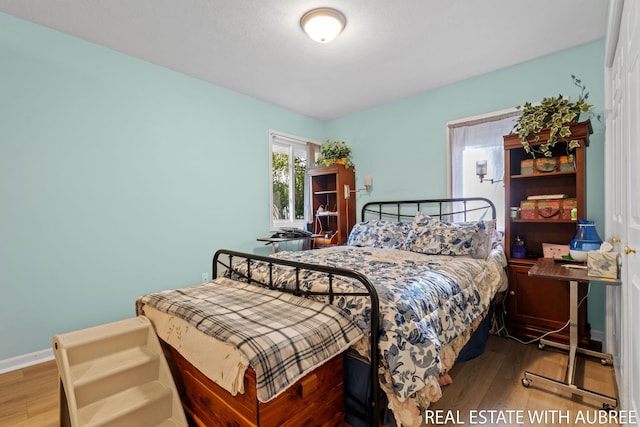 38 W 31st St, Holland, MI 49423 - bedroom with wood finished floors and baseboards