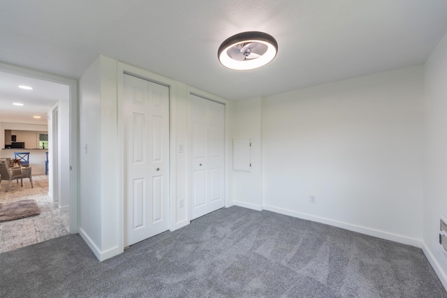 3687 111th Ave, Allegan, MI 49010 - unfurnished bedroom featuring carpet floors, multiple closets, and baseboards