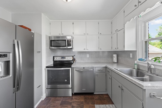 113 Greenleaf St, Onsted, MI 49265 - kitchen with appliances with stainless steel finishes, a sink, light countertops, and white cabinets