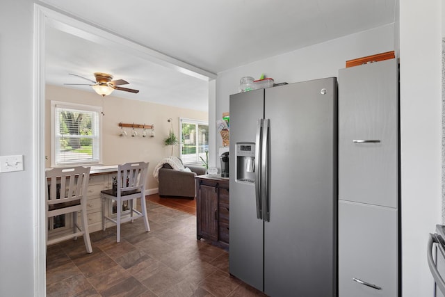 113 Greenleaf St, Onsted, MI 49265 - kitchen with stainless steel fridge, healthy amount of natural light, ceiling fan, and open floor plan