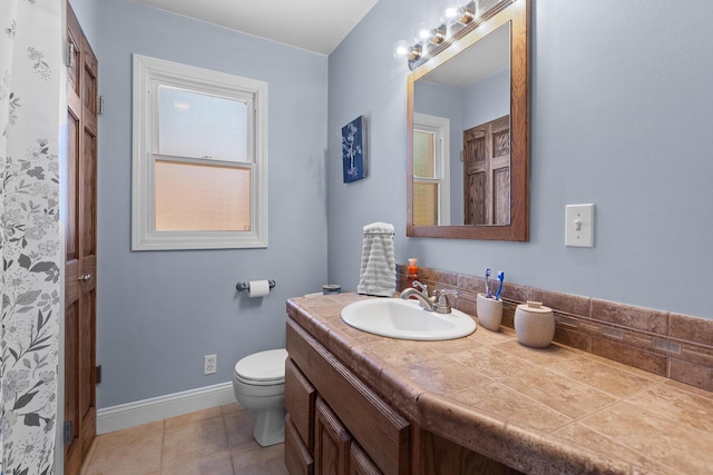 113 Greenleaf St, Onsted, MI 49265 - bathroom featuring vanity, toilet, baseboards, and tile patterned floors