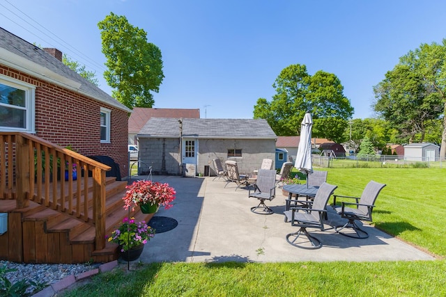 113 Greenleaf St, Onsted, MI 49265 - view of patio / terrace featuring an outbuilding