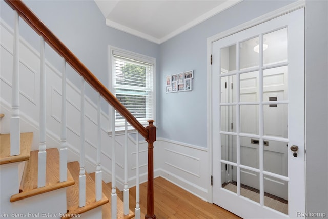 480 Fisher Rd, Grosse Pointe Farms, MI 48230 - stairs with wood finished floors, wainscoting, and a decorative wall