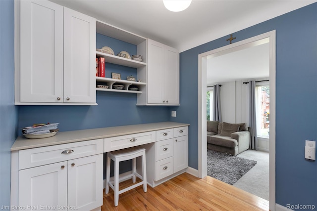 480 Fisher Rd, Grosse Pointe Farms, MI 48230 - office area with built in desk and light wood-style floors