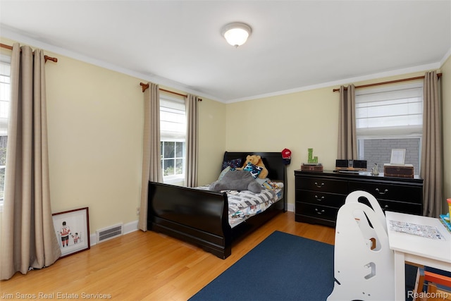 480 Fisher Rd, Grosse Pointe Farms, MI 48230 - bedroom featuring light wood finished floors, ornamental molding, and baseboards