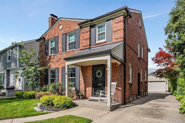 480 Fisher Rd, Grosse Pointe Farms, MI 48230 - view of front of home with brick siding, an outdoor structure, a detached garage, and a chimney
