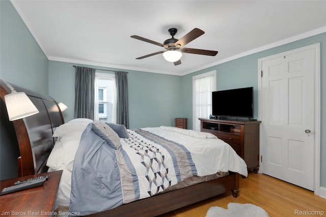 480 Fisher Rd, Grosse Pointe Farms, MI 48230 - bedroom featuring ornamental molding, light wood-style floors, and a ceiling fan