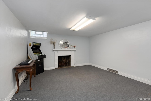 480 Fisher Rd, Grosse Pointe Farms, MI 48230 - living area featuring a brick fireplace, dark colored carpet, and baseboards