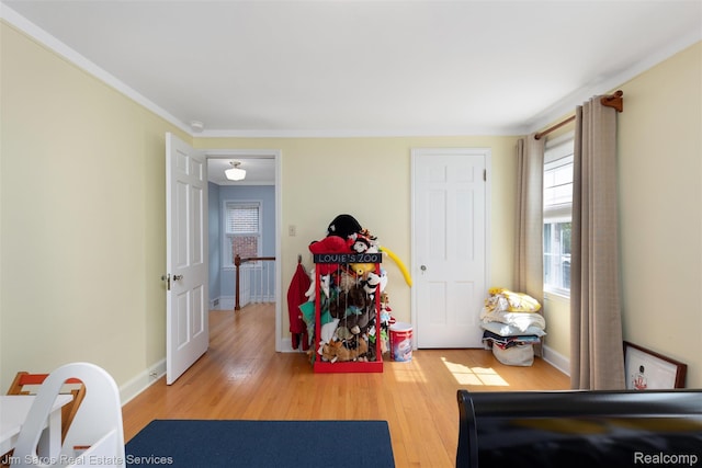 480 Fisher Rd, Grosse Pointe Farms, MI 48230 - game room with wood finished floors, baseboards, and crown molding