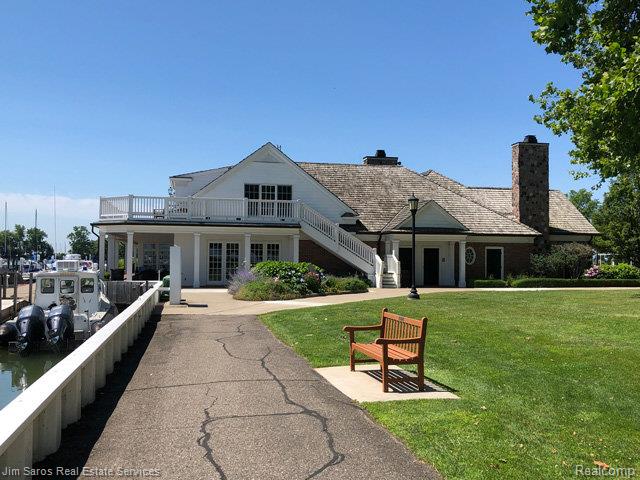 480 Fisher Rd, Grosse Pointe Farms, MI 48230 - back of house featuring a yard, stairs, a chimney, french doors, and a wooden deck