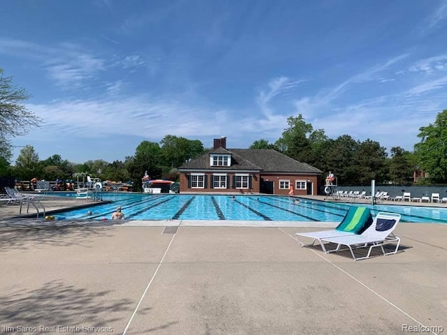 480 Fisher Rd, Grosse Pointe Farms, MI 48230 - community pool featuring a patio and view of scattered trees