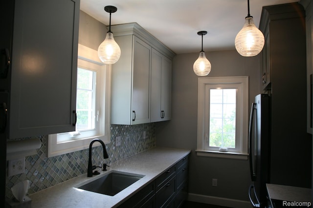 717 W 12 Mile Rd, Royal Oak, MI 48073 - kitchen featuring a sink, freestanding refrigerator, tasteful backsplash, and healthy amount of natural light
