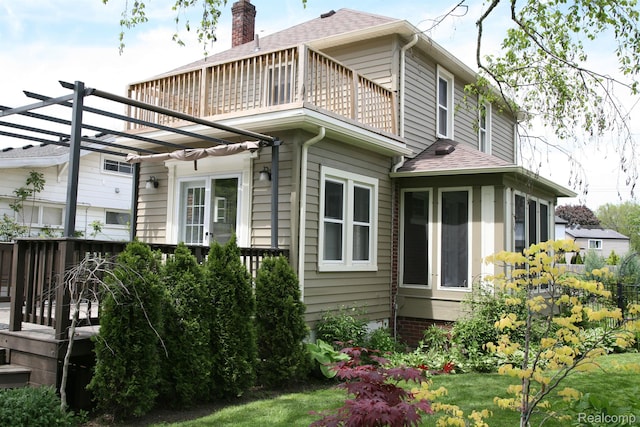 717 W 12 Mile Rd, Royal Oak, MI 48073 - view of side of property with a balcony, a pergola, and a shingled roof