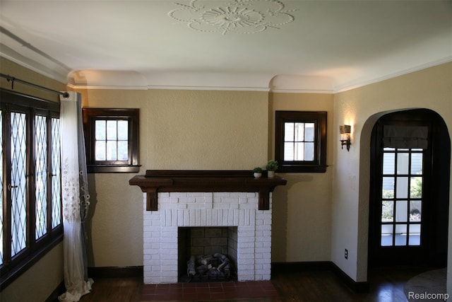 717 W 12 Mile Rd, Royal Oak, MI 48073 - unfurnished living room featuring healthy amount of natural light, wood finished floors, a fireplace, ornamental molding, and a textured wall