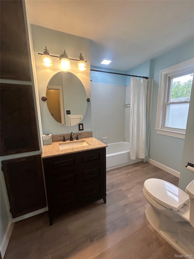 717 W 12 Mile Rd, Royal Oak, MI 48073 - bathroom with vanity, toilet, wood finished floors, and shower / tub combo