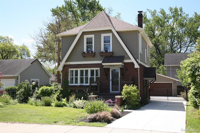 717 W 12 Mile Rd, Royal Oak, MI 48073 - view of front of home with an outdoor structure, a chimney, brick siding, a front yard, and roof with shingles