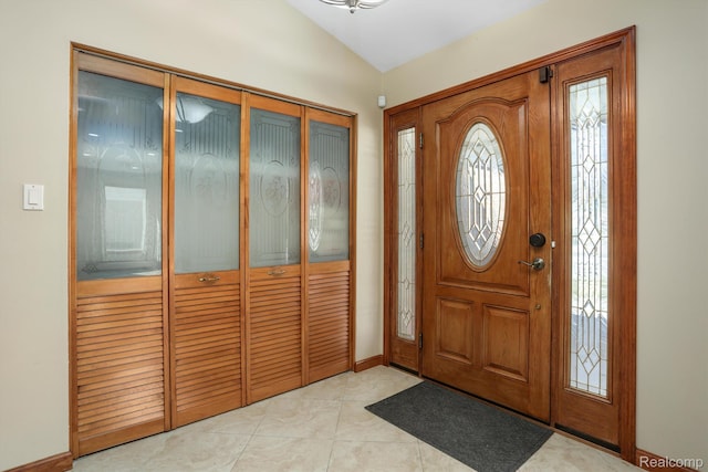 4173 Brandywyne Dr, Troy, MI 48098 - foyer with vaulted ceiling, baseboards, and light tile patterned flooring