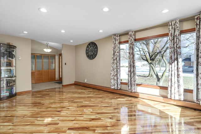 4173 Brandywyne Dr, Troy, MI 48098 - unfurnished room featuring recessed lighting, wood finished floors, healthy amount of natural light, baseboards, and vaulted ceiling