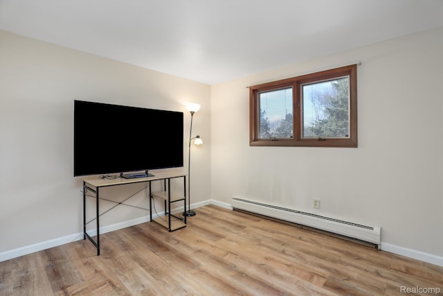 4173 Brandywyne Dr, Troy, MI 48098 - unfurnished living room featuring a baseboard heating unit, wood finished floors, and baseboards