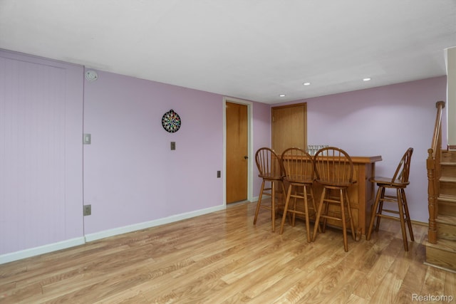 4173 Brandywyne Dr, Troy, MI 48098 - dining area with a bar, wood finished floors, baseboards, and recessed lighting