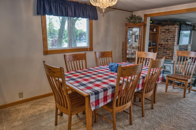 1352 Haughey Dr, Union City, MI 49094 - carpeted dining space featuring healthy amount of natural light, a chandelier, and baseboards