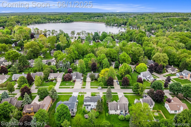 7674 Woodside Pl, Waterford, MI 48327 - aerial perspective of suburban area featuring a nearby body of water and a heavily wooded area