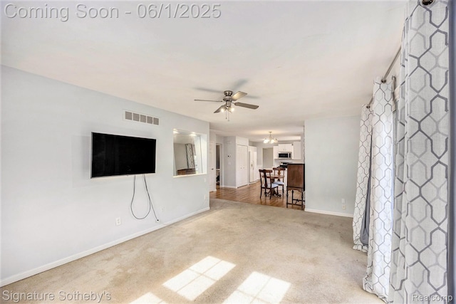7674 Woodside Pl, Waterford, MI 48327 - unfurnished living room with carpet floors, baseboards, and a ceiling fan