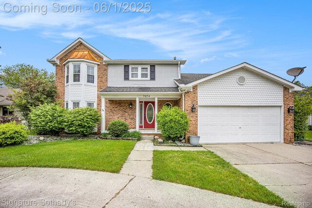 7674 Woodside Pl, Waterford, MI 48327 - view of front of home with driveway, an attached garage, brick siding, a front yard, and covered porch