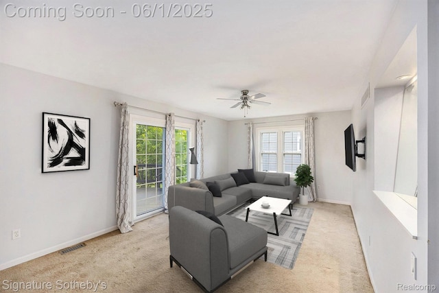 7674 Woodside Pl, Waterford, MI 48327 - carpeted living room with baseboards and ceiling fan