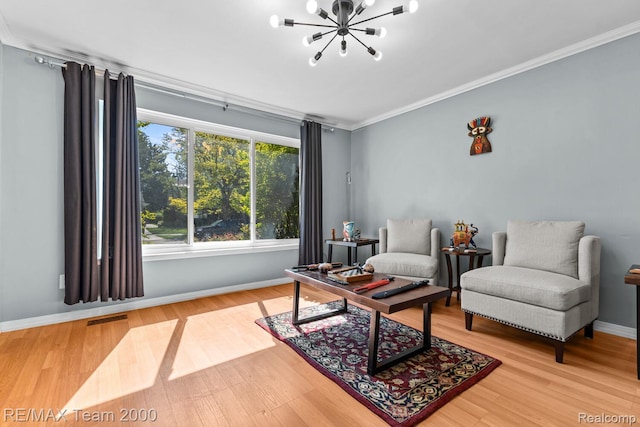 7485 Pointe Dr, Canton, MI 48187 - living area with a chandelier, ornamental molding, baseboards, and wood finished floors