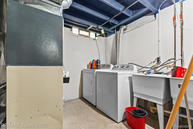 7485 Pointe Dr, Canton, MI 48187 - laundry area with washer and dryer and heating unit