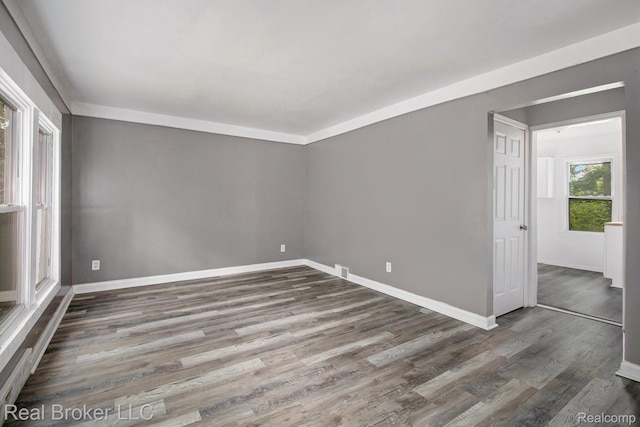 19455 Houghton St, Detroit, MI 48219 - spare room with wood finished floors and baseboards