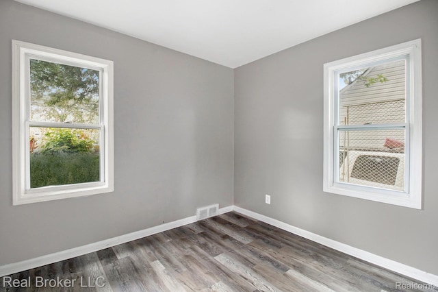 19455 Houghton St, Detroit, MI 48219 - unfurnished room with dark wood finished floors and baseboards