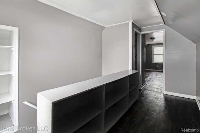 19455 Houghton St, Detroit, MI 48219 - hall with dark wood-style floors, lofted ceiling, built in shelves, and baseboards