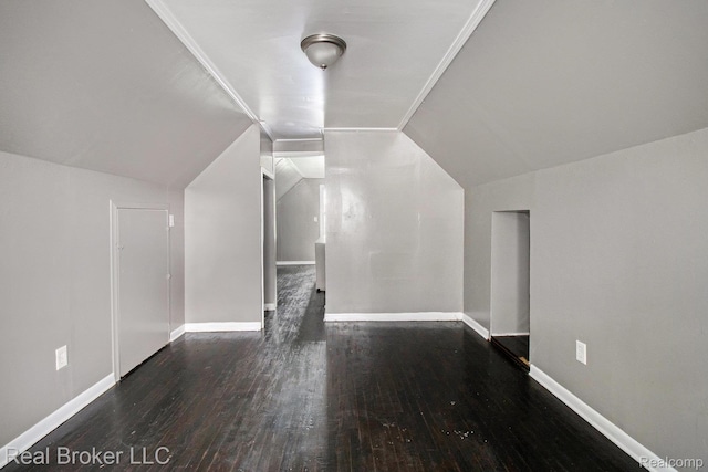 19455 Houghton St, Detroit, MI 48219 - additional living space with wood finished floors, vaulted ceiling, and baseboards