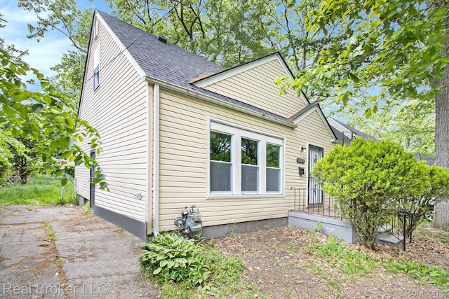 19455 Houghton St, Detroit, MI 48219 - view of front of property with roof with shingles and a patio area