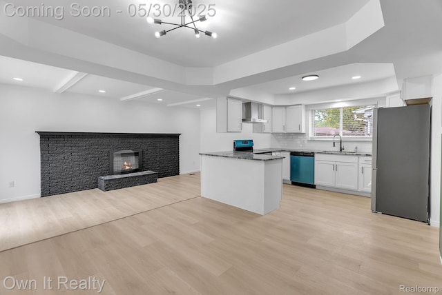 10419 Michael St, Dearborn, MI 48180 - kitchen featuring freestanding refrigerator, wall chimney exhaust hood, dishwashing machine, open floor plan, and a sink