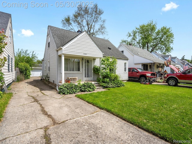 26066 Dartmouth St, Royal Oak, MI 48071 - view of front facade with a shingled roof and a front yard