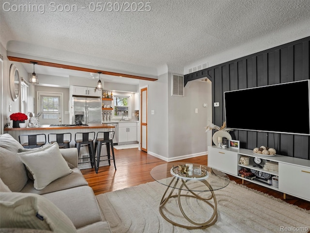 26066 Dartmouth St, Royal Oak, MI 48071 - living room with wood finished floors and a textured ceiling