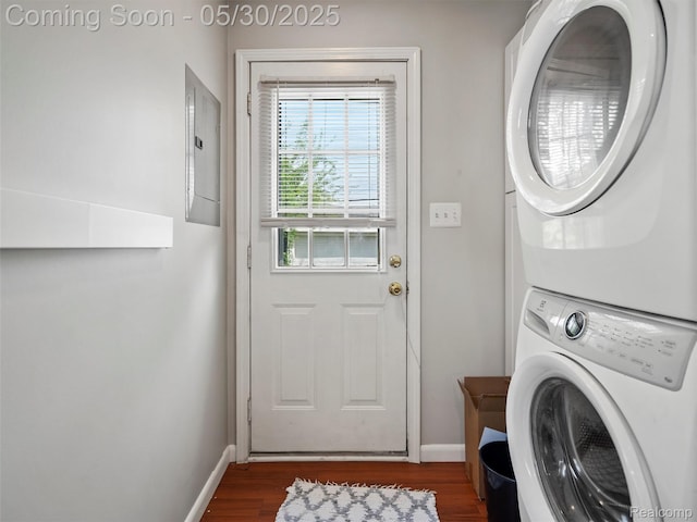 26066 Dartmouth St, Royal Oak, MI 48071 - washroom featuring stacked washer and clothes dryer, baseboards, dark wood finished floors, and electric panel