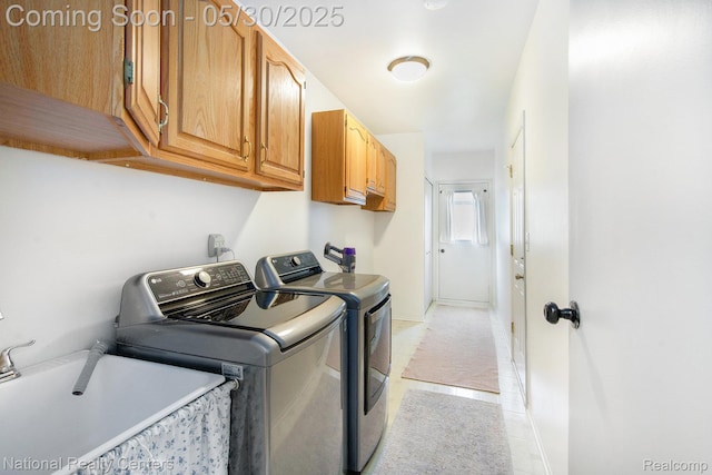 44947 Partridge Dr, Plymouth, MI 48170 - laundry area featuring cabinet space, separate washer and dryer, and baseboards