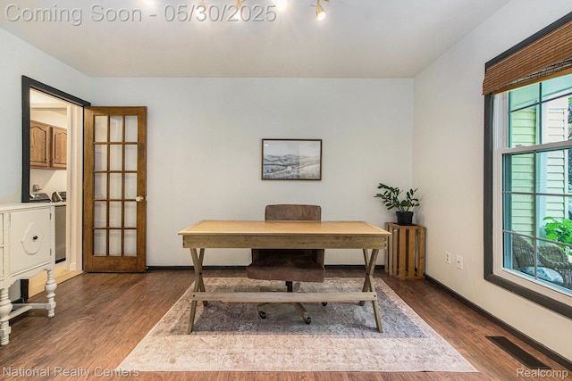 44947 Partridge Dr, Plymouth, MI 48170 - office space featuring separate washer and dryer, dark wood-style floors, and baseboards