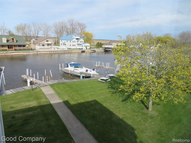 3129 Midshipman, Au Gres, MI 48703 - dock area featuring a water view, boat lift, a lawn, and a residential view