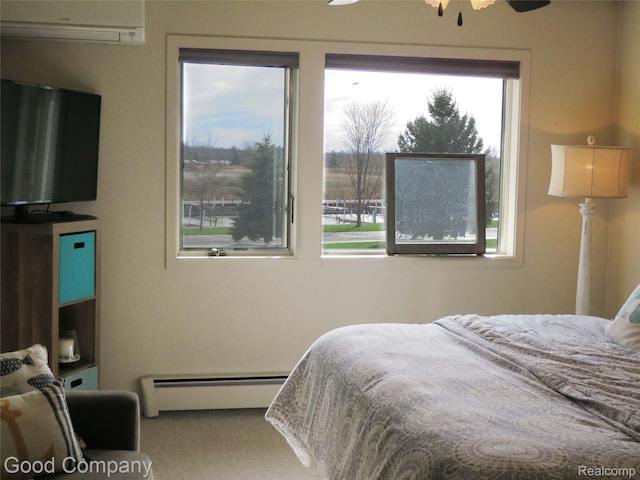 3129 Midshipman, Au Gres, MI 48703 - bedroom featuring baseboard heating, multiple windows, a wall unit AC, and carpet floors