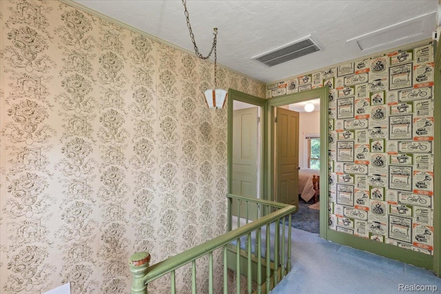 91 Dennison St, Oxford, MI 48371 - corridor featuring carpet flooring, an upstairs landing, wallpapered walls, and attic access